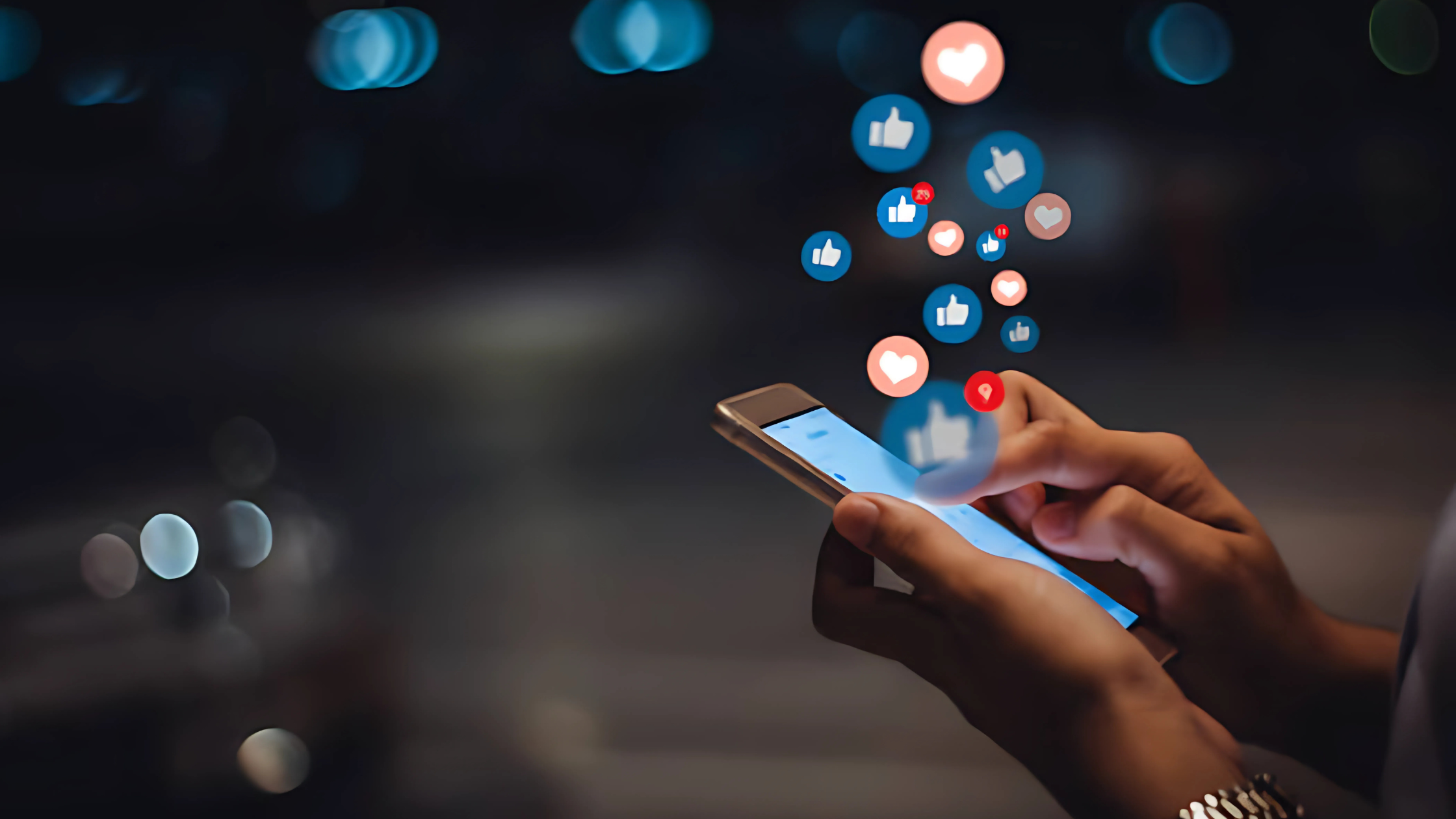 An individual holding a smartphone with various positive reaction icons, such as thumbs up, heart, and smiley faces, popping out from the screen. The image symbolizes a brand's positive reception and engagement from customers, reflecting excitement and approval.
